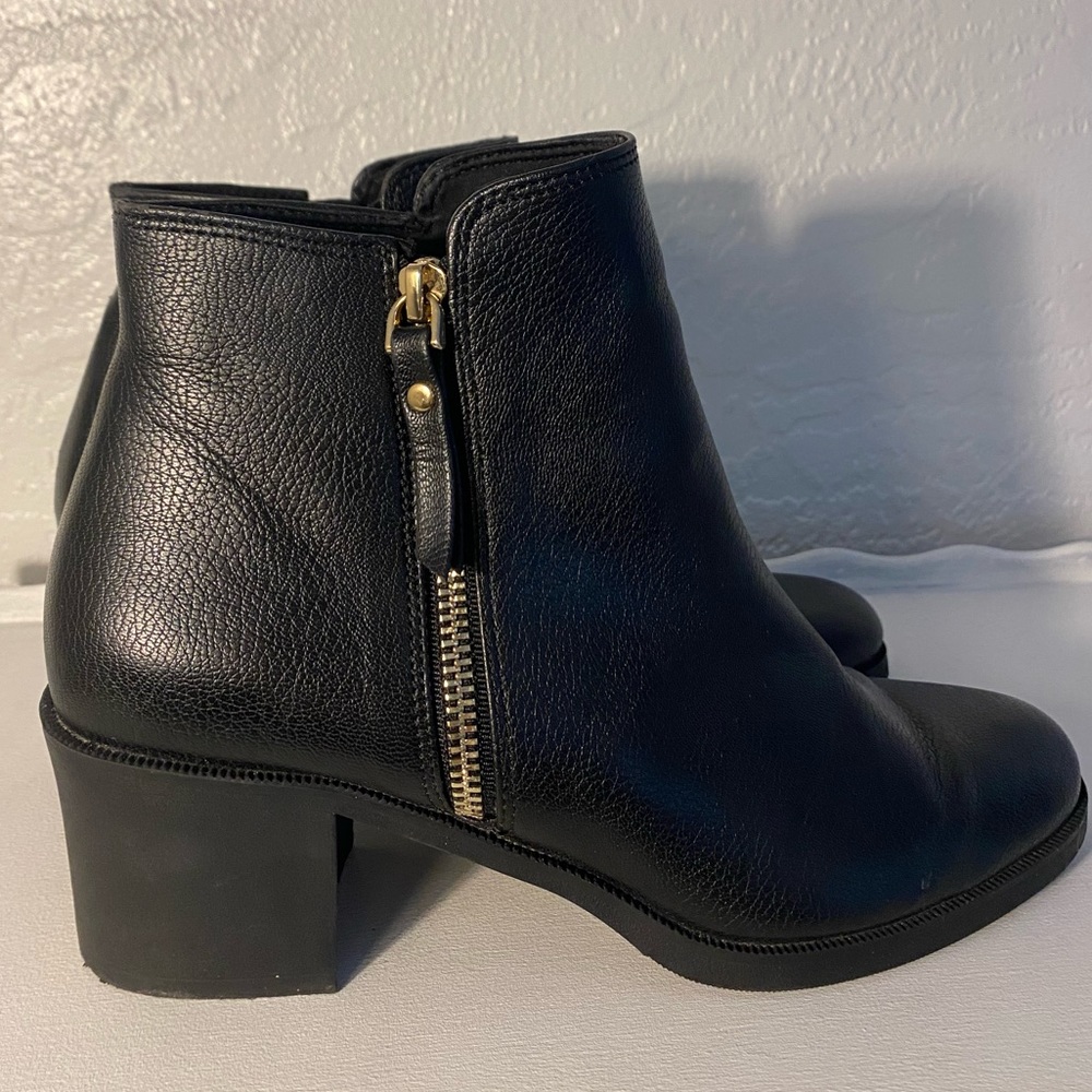 Black leather booties with gold zipper. Size 8
